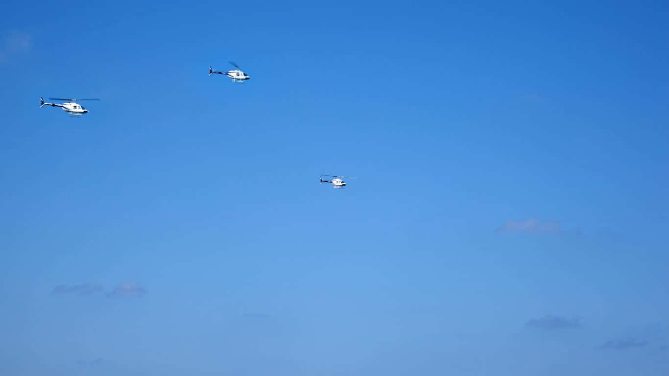 Aerial view of a fleet of Helicopters flying in formation