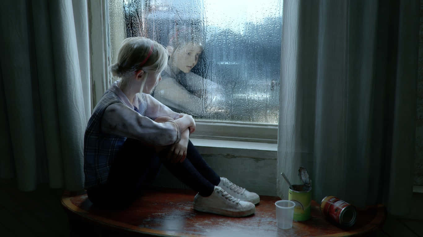A Girl Sitting On A Window Sill Looking Out