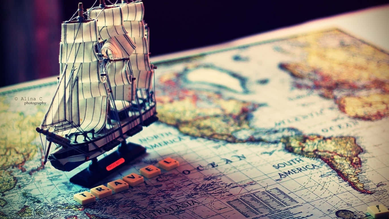 1366x768 Travel Ship Figurine On Map Background