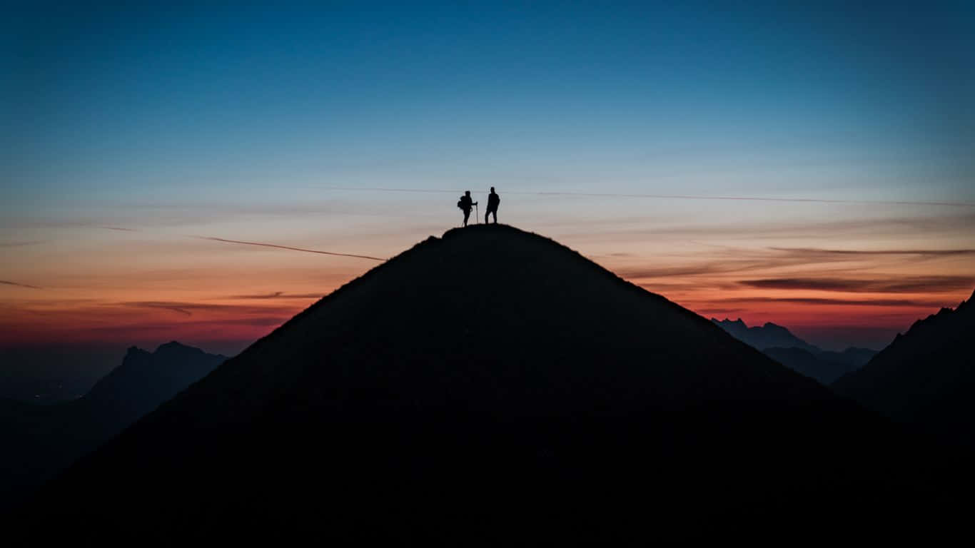 1366x768 Two People Silhouettes On Hill Travel Background