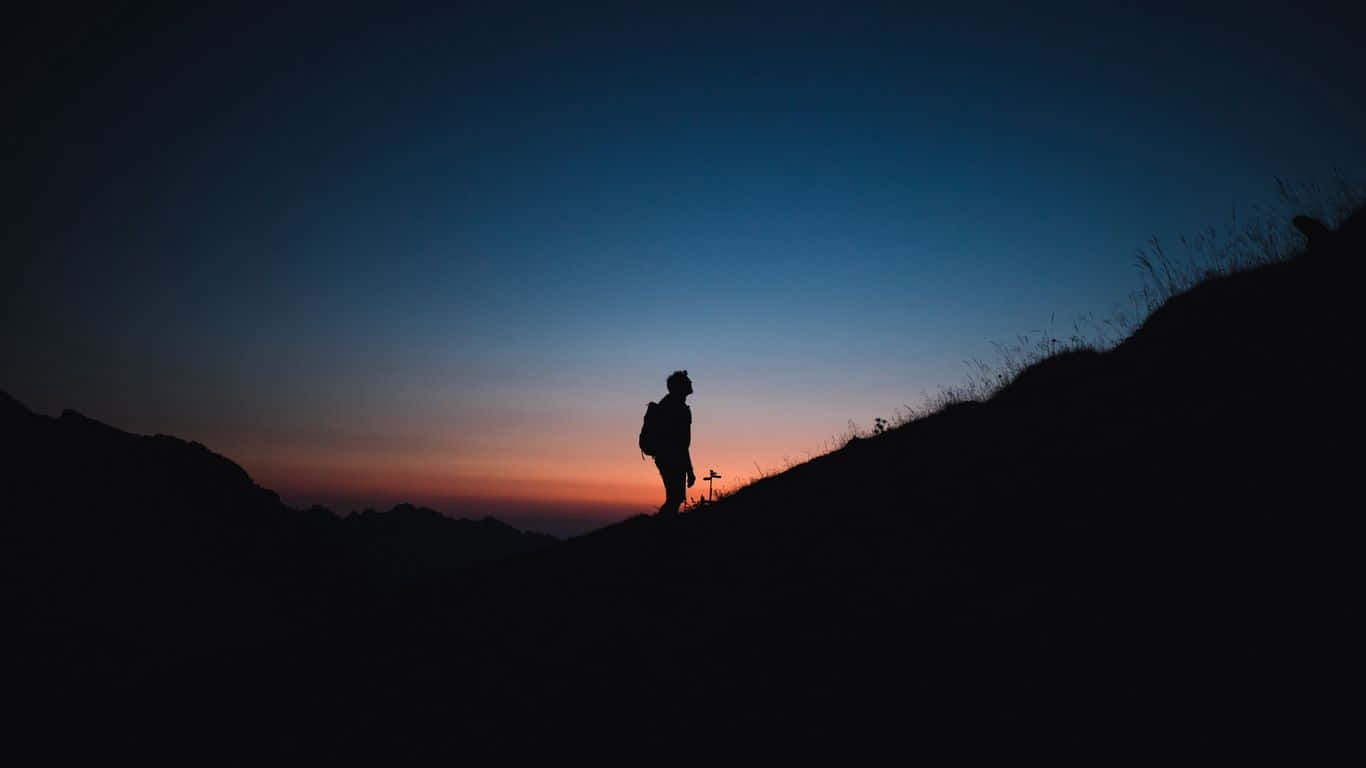 1366x768 Man Silhouette On Mountain Travel Background