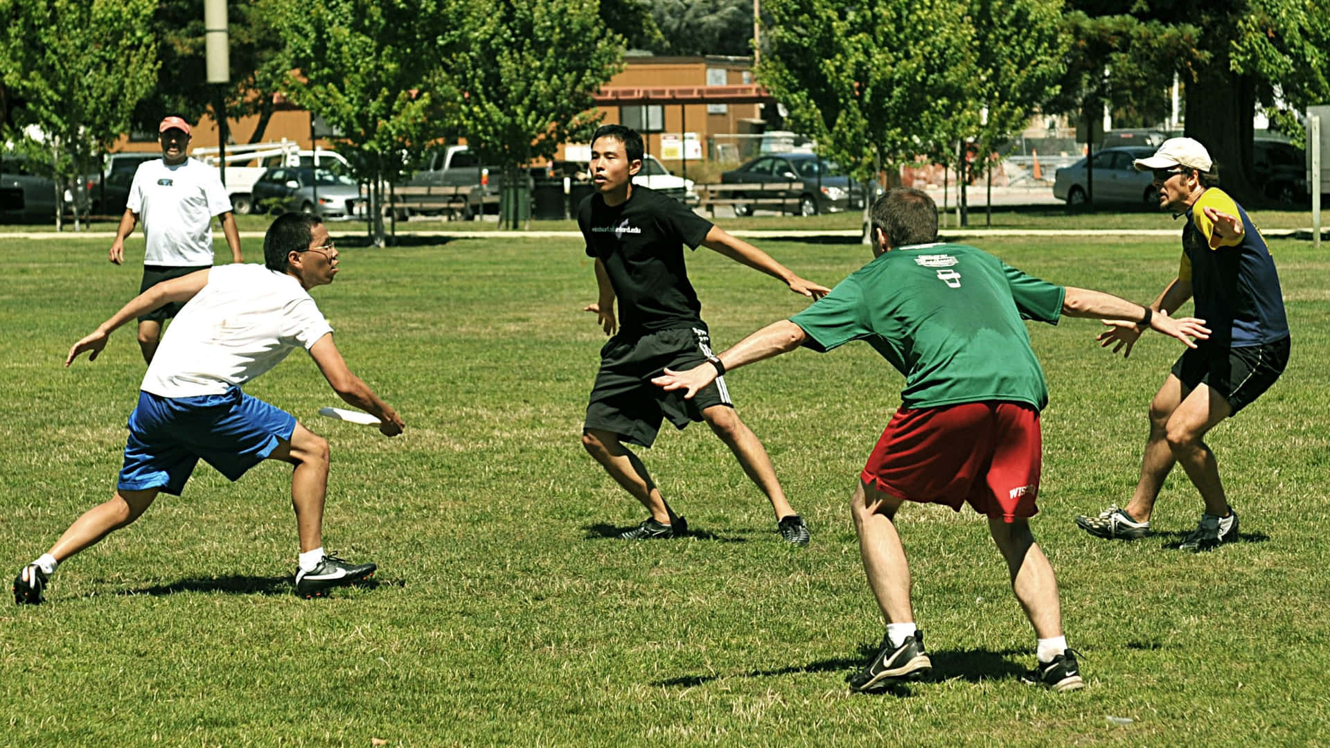 A Group Of People Playing Frisbee