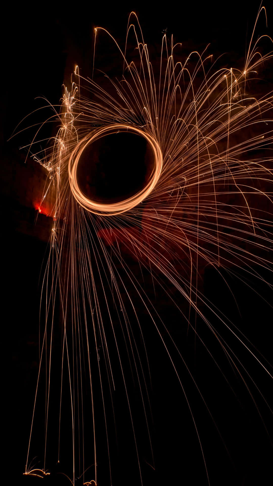 A Circle Of Sparks In The Dark Wallpaper