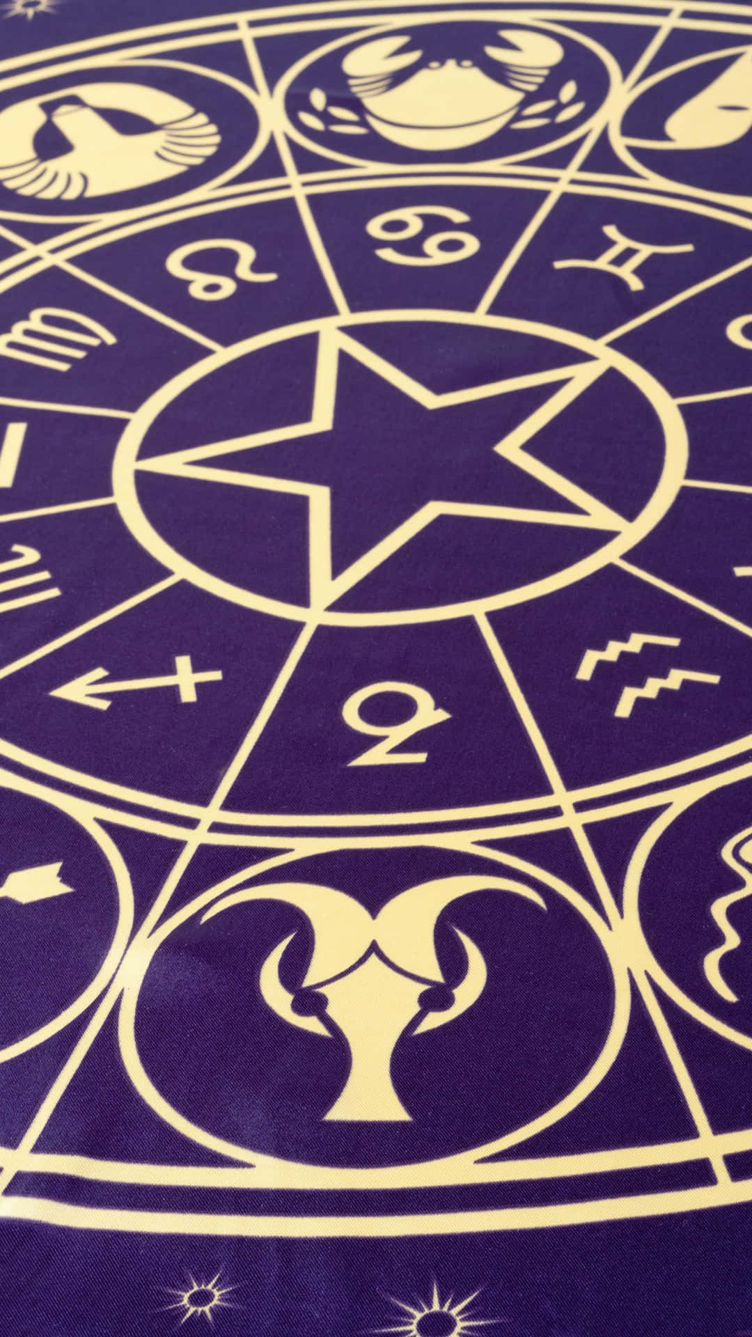 A Purple Rug With Astrological Symbols On It Wallpaper