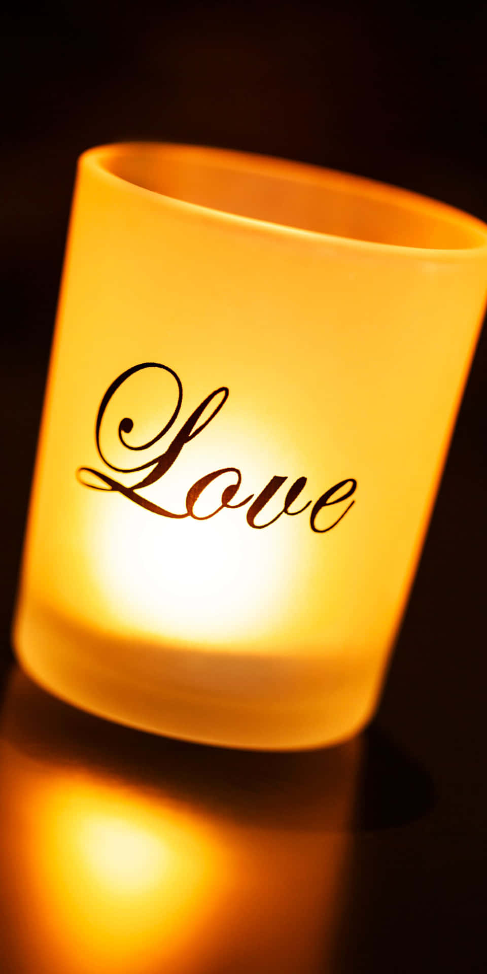 A Candle With The Word Love Written On It Wallpaper