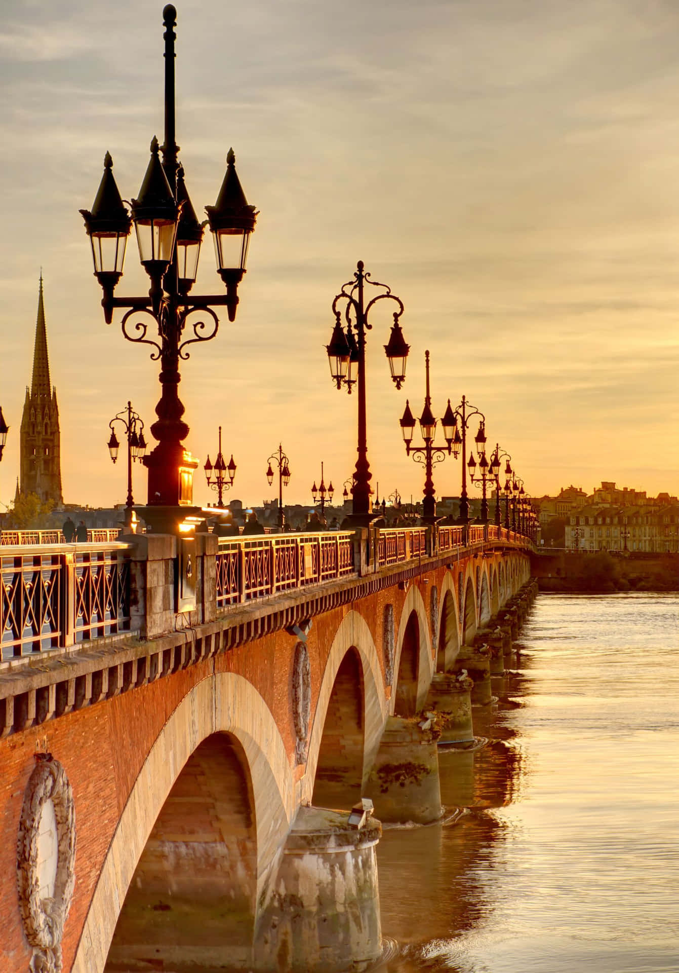 A Bridge Over A River With Lights On It Wallpaper