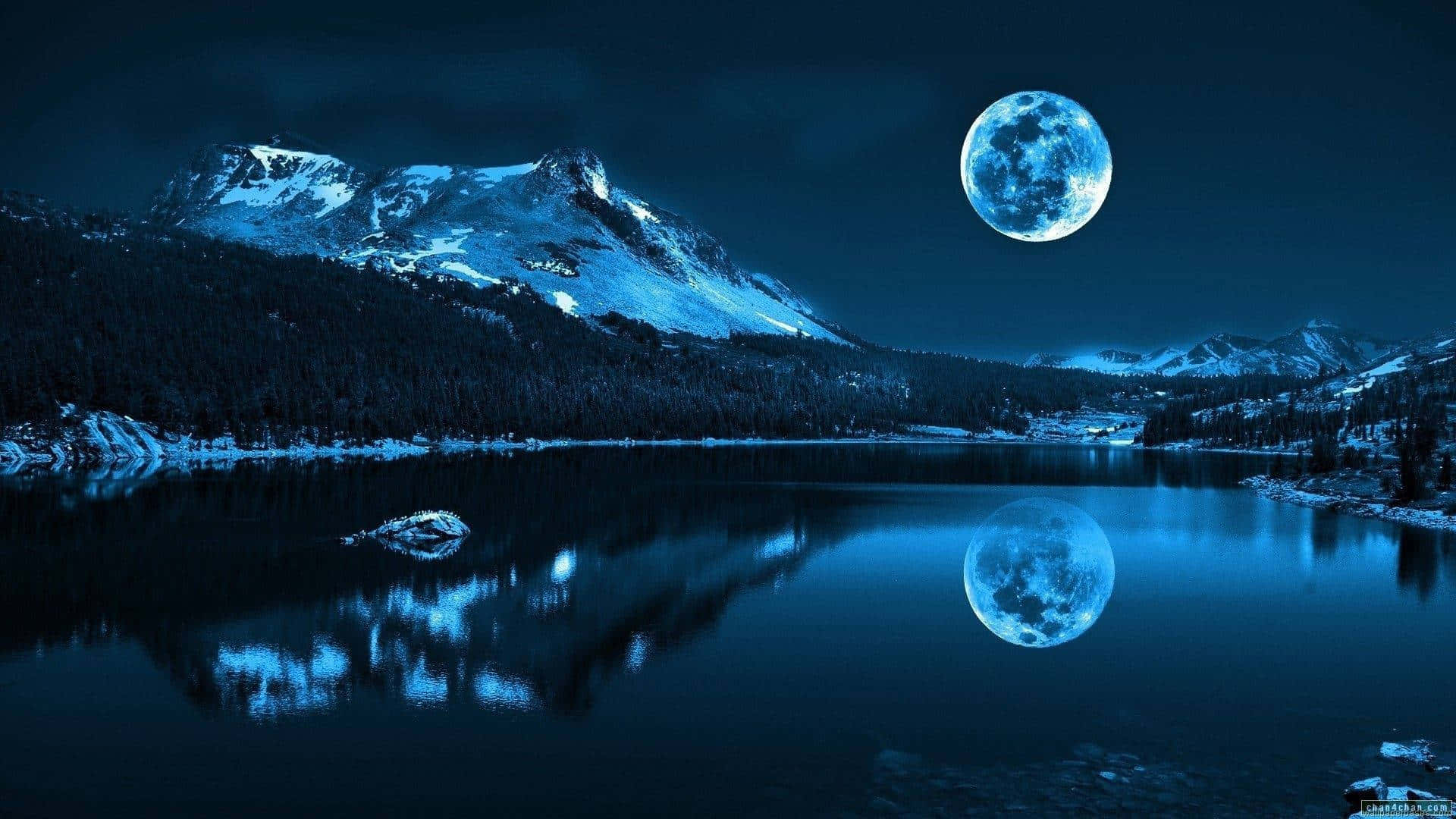 A Moon Is Reflected In A Lake With Mountains Wallpaper