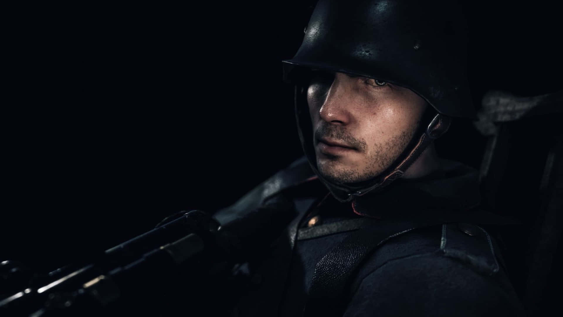 A Soldier In A Helmet Is Holding A Rifle
