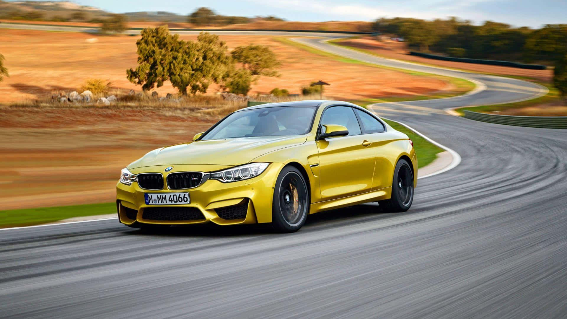 1920x1080 BMW Golden M4 Curved Road Wallpaper