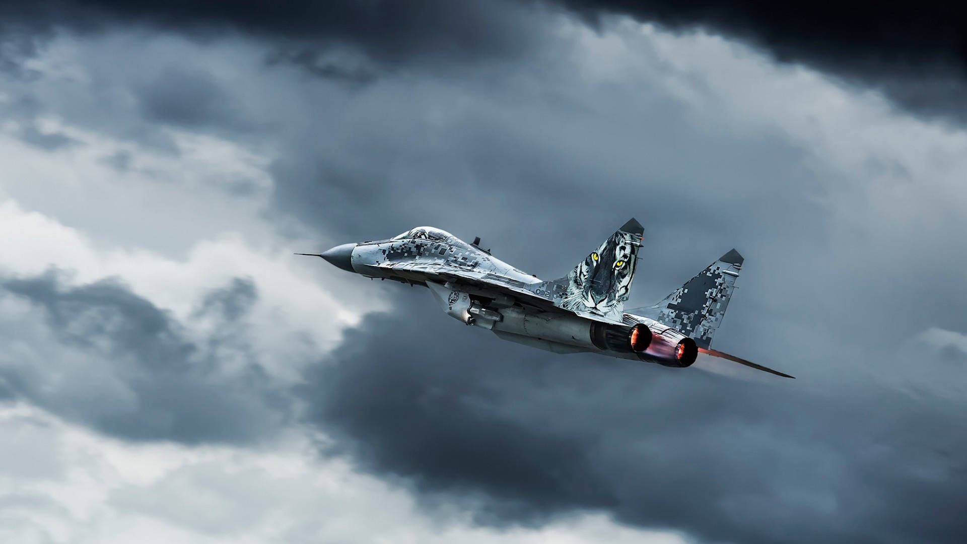 A Fighter Jet Flying Through A Cloudy Sky Wallpaper