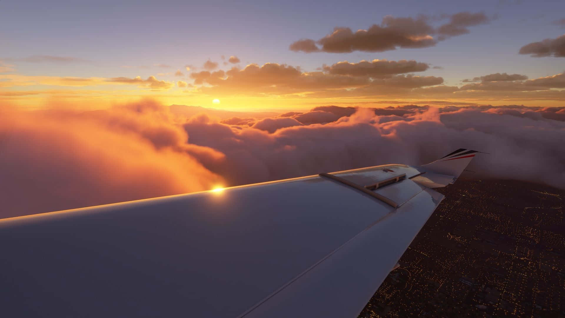 A Plane Wing Flying Over The Clouds At Sunset