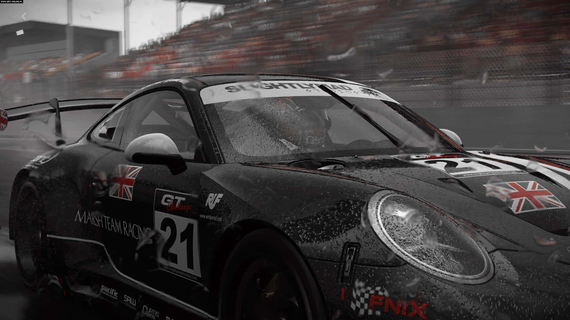 A Porsche Gt3 Racing Car Is Shown In The Rain