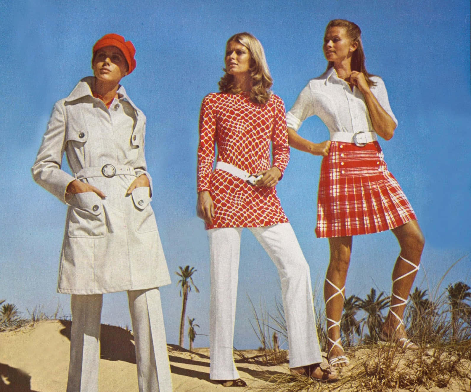 Three Women Standing In The Sand