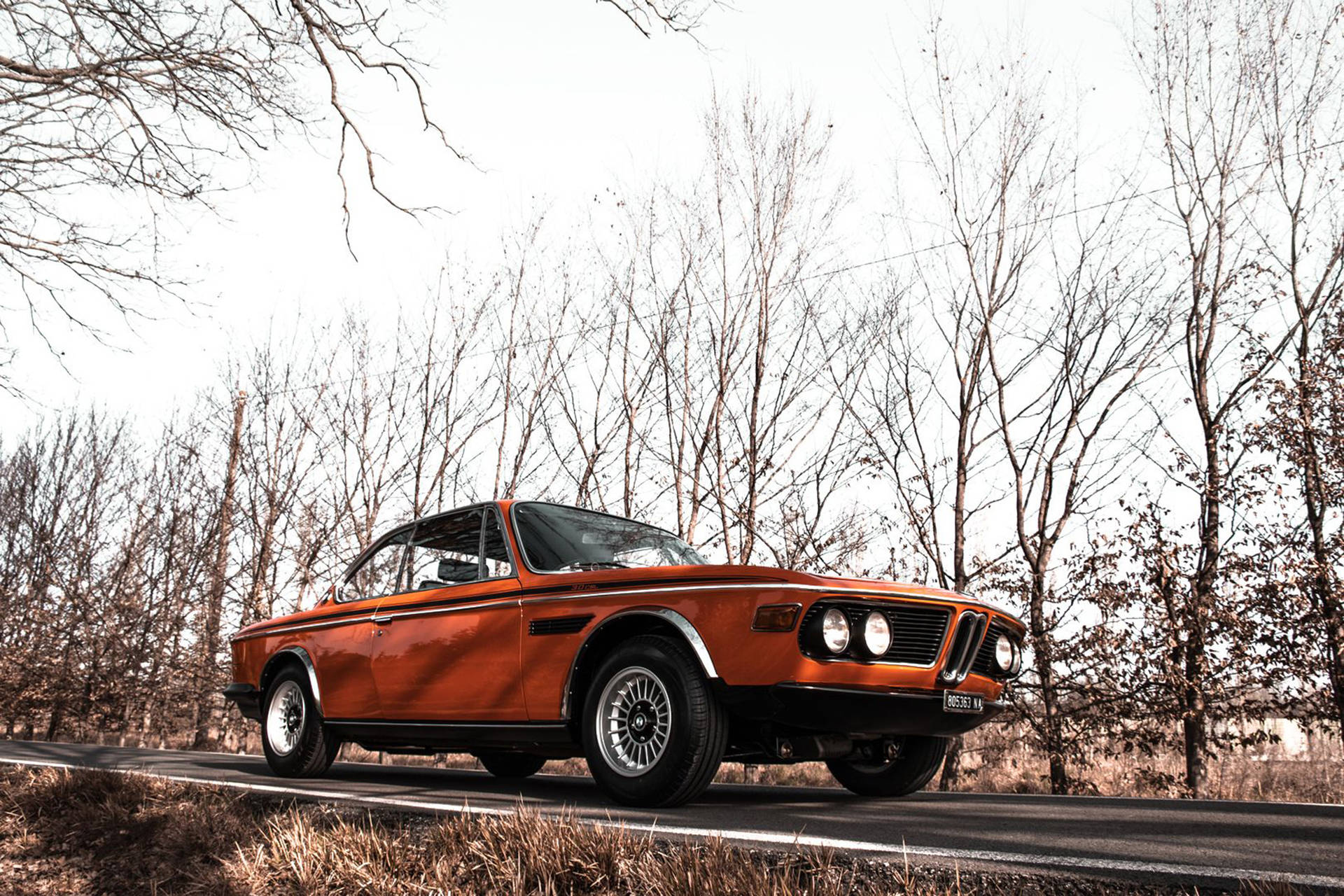 Elegant 1971 Classic BMW Shining Under Bright Lights Wallpaper