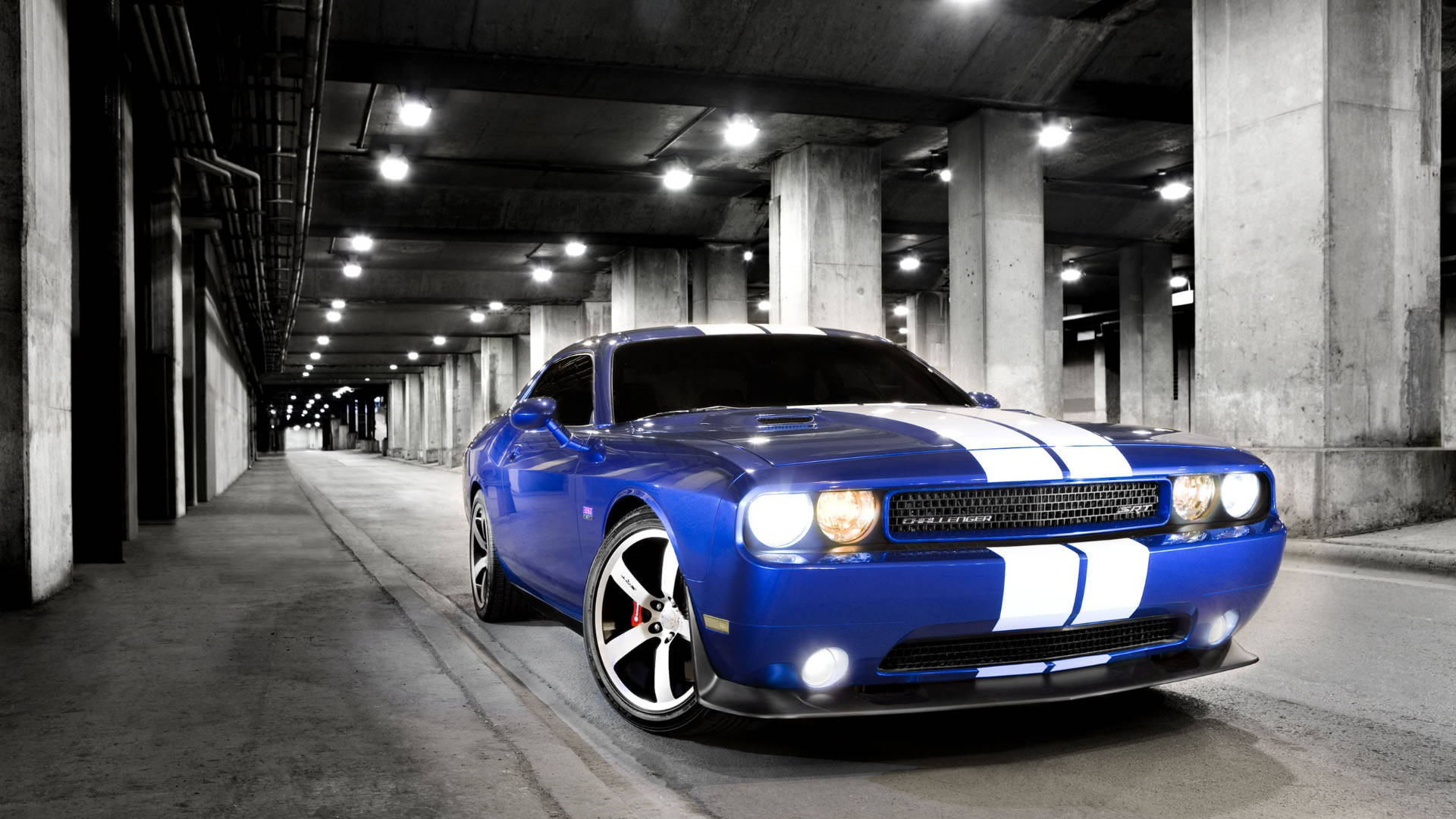 Caption: Stunning Blue Dodge Challenger Parked Majestically Wallpaper