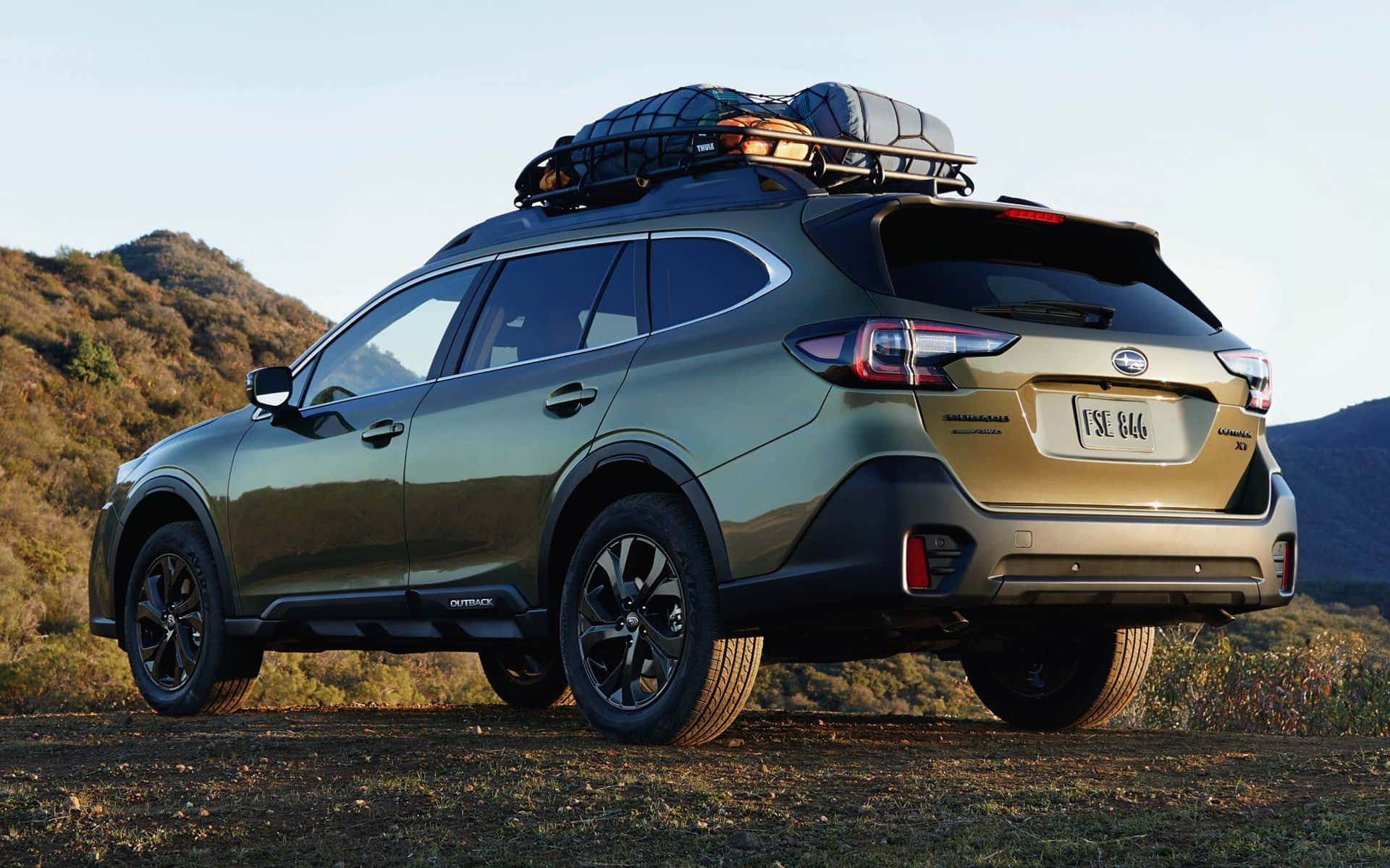 2021 Subaru Outback Roaring Through The Landscape Wallpaper