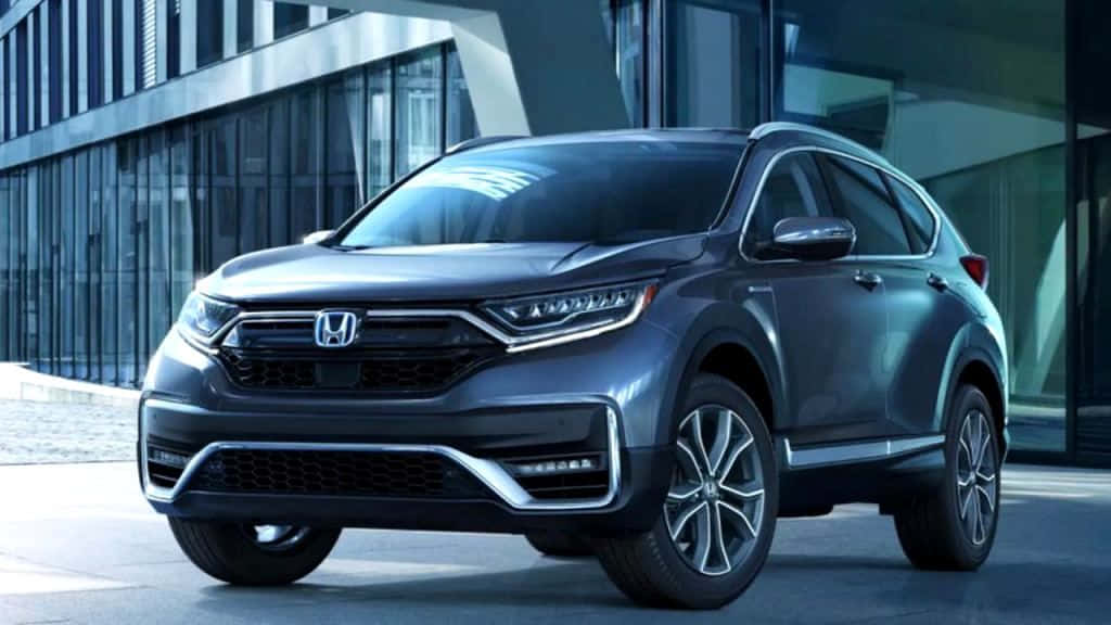 The 2020 Honda Cr - V Is Shown In Front Of A Building