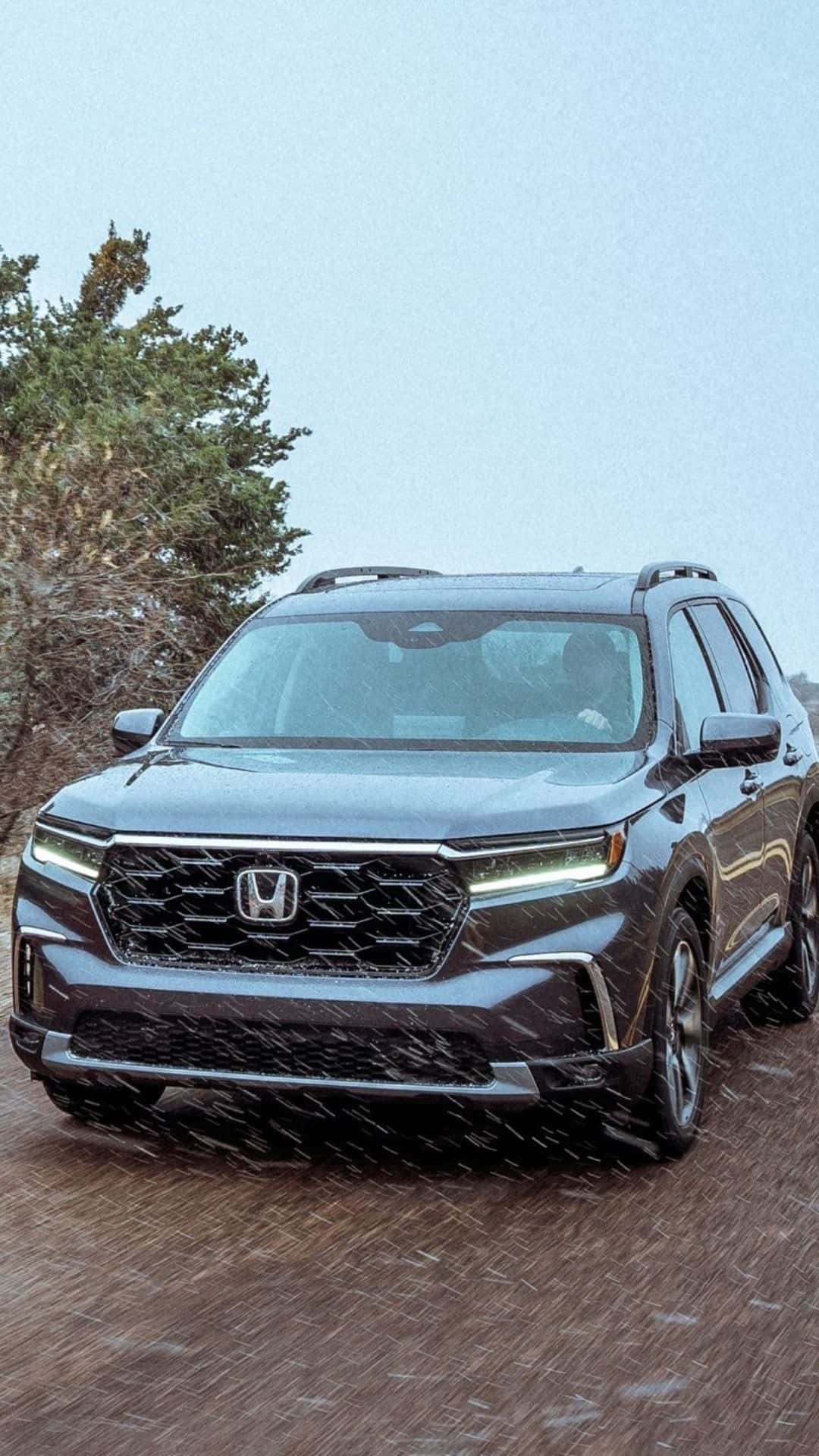 The 2020 Honda Traverse Is Driving Down A Dirt Road