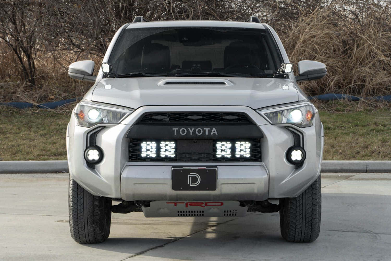 The Front End Of A Silver Toyota 4runner