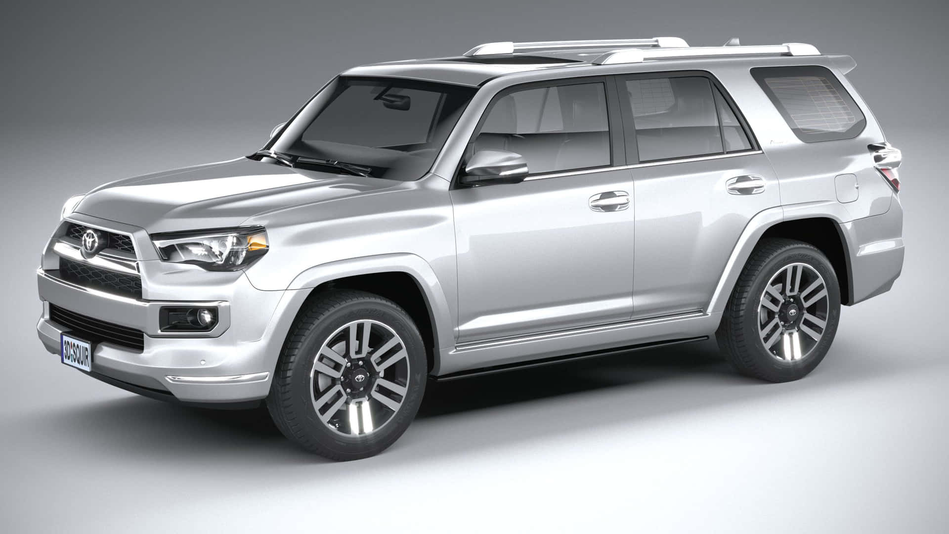The Silver Toyota 4runner Is Shown On A Gray Background