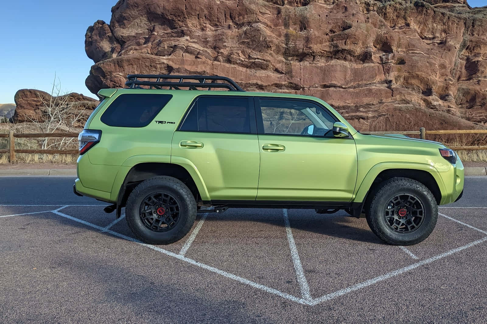 A Green Toyota 4runner Parked In A Parking Lot