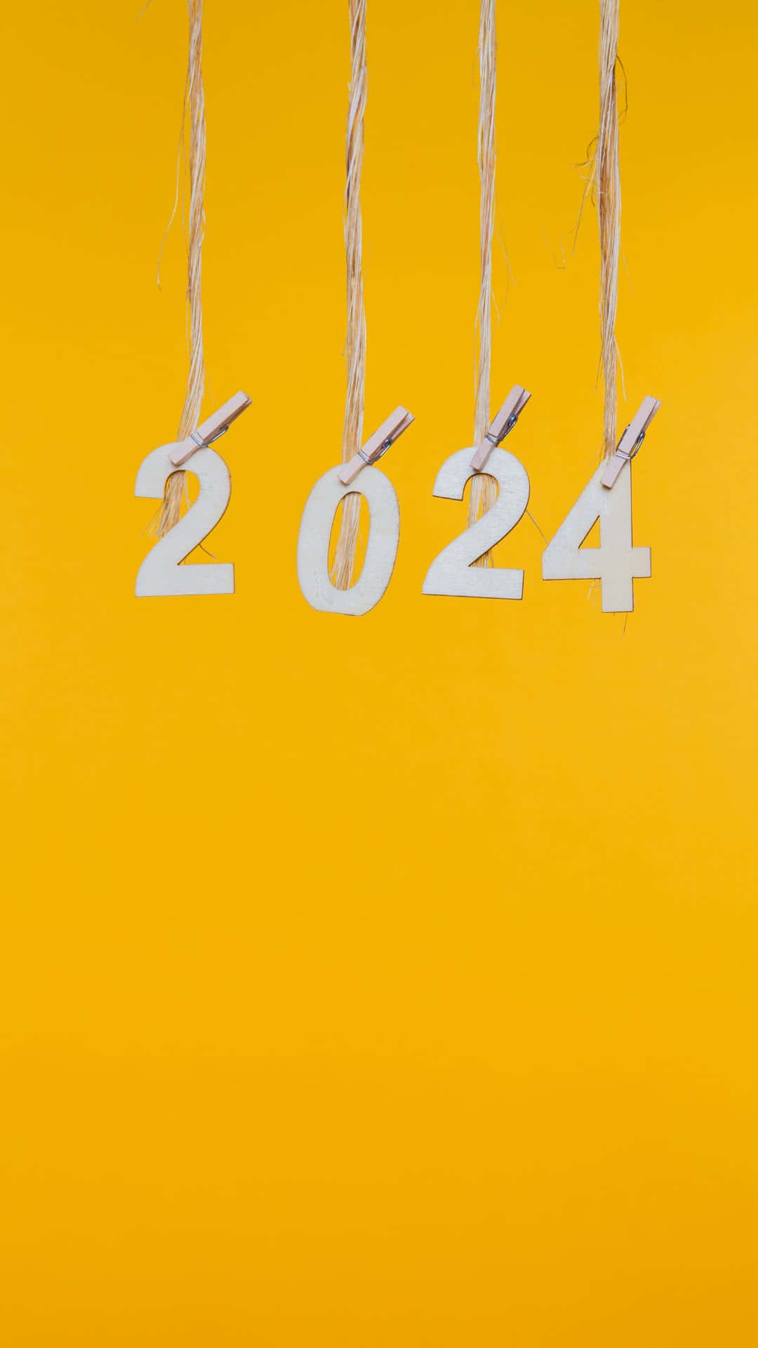 2024 New Year Concept Yellow Background Wallpaper