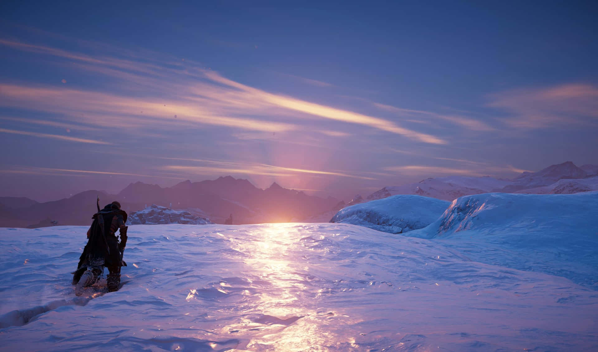 A Man Is Standing On A Snowy Mountain In The Evening