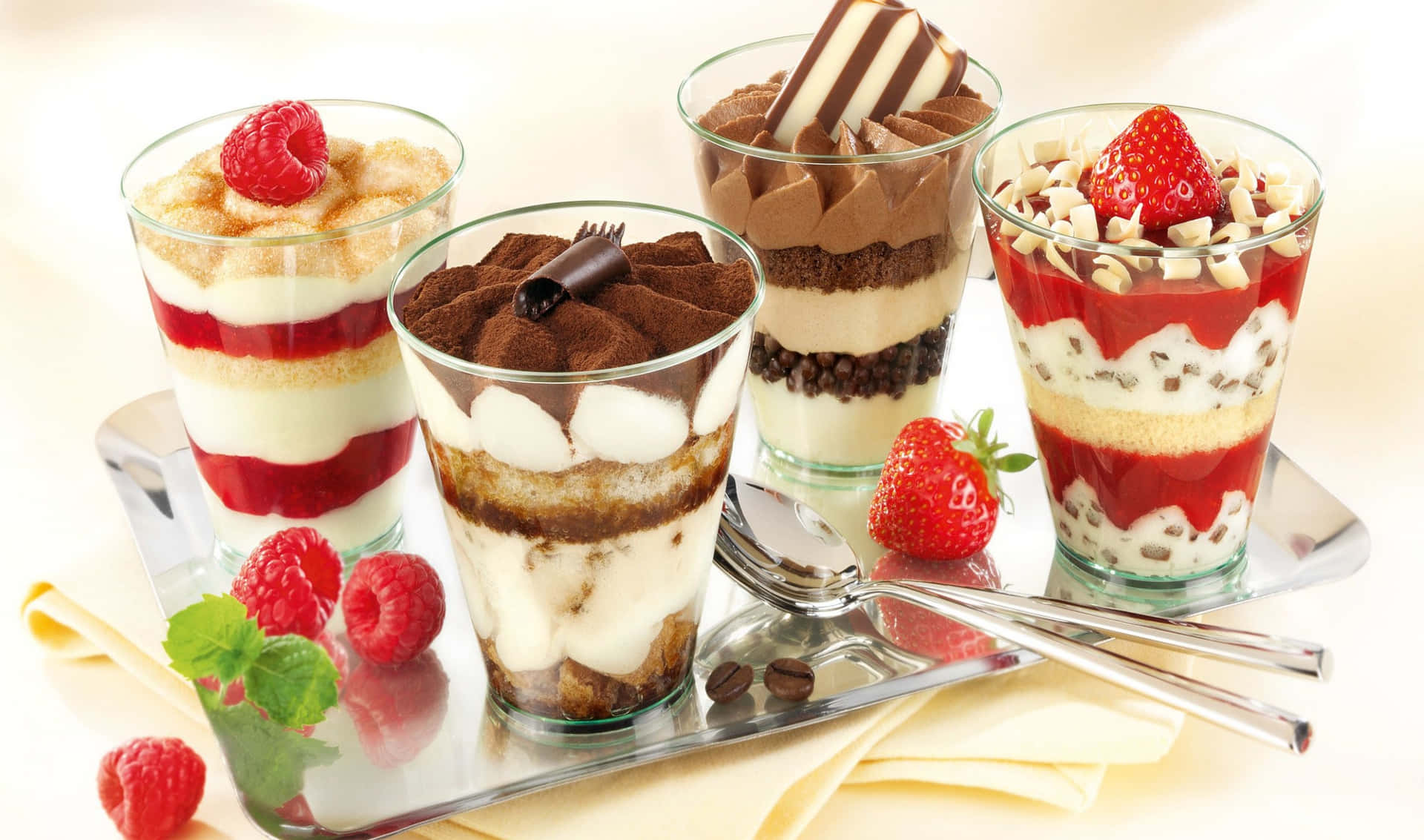A Tray Of Desserts With Strawberries And Chocolate