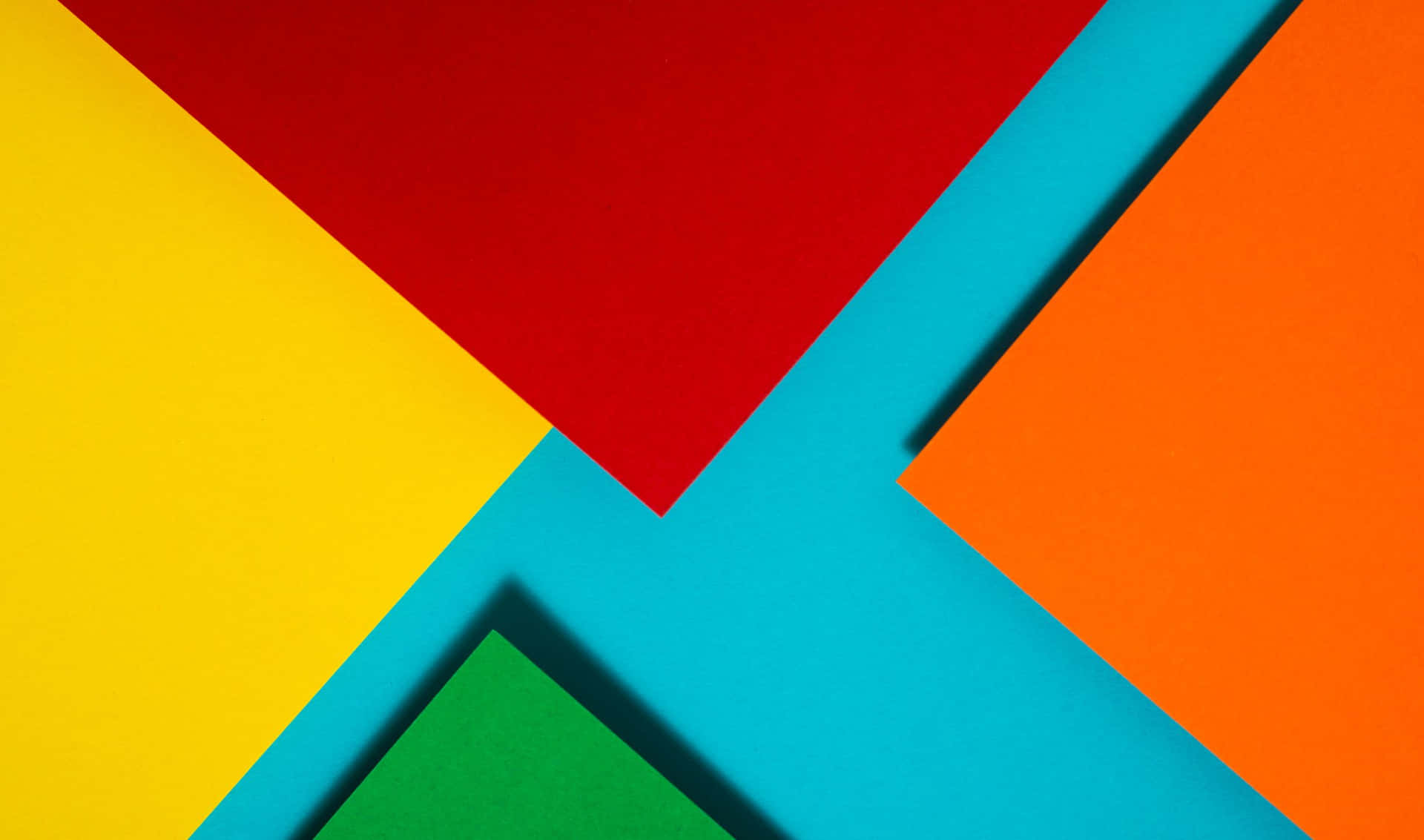 A Colorful Paper Background With Triangles