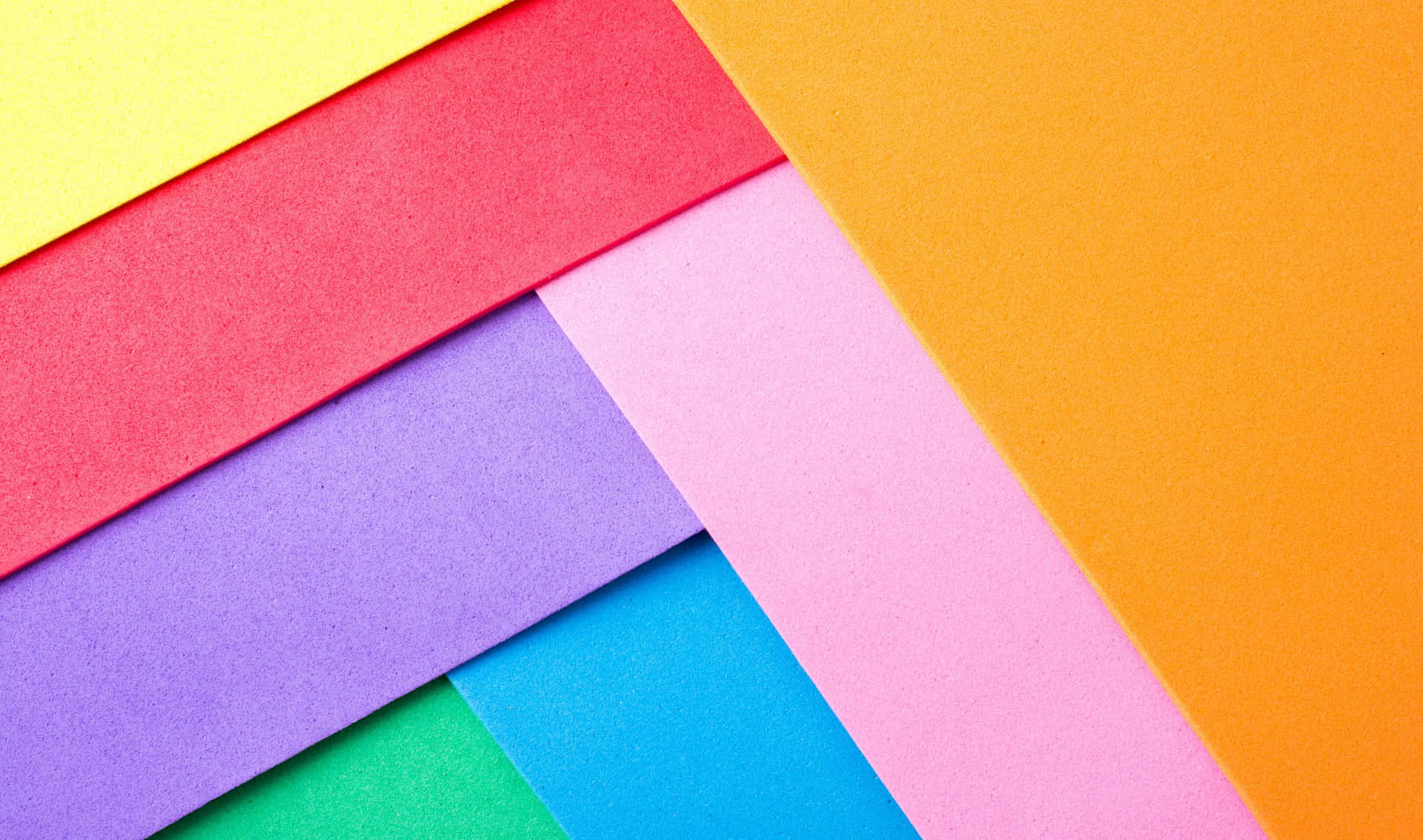 A Stack Of Colorful Paper