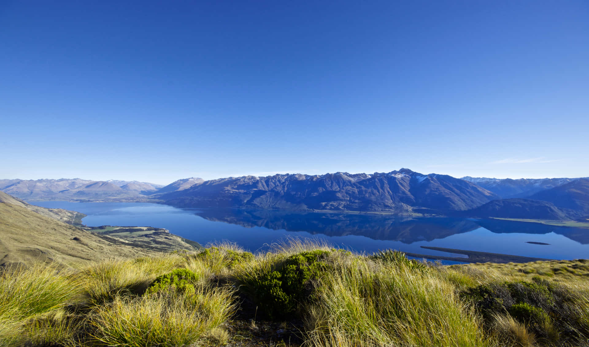 a view of lake wanaka from the top of a mountain