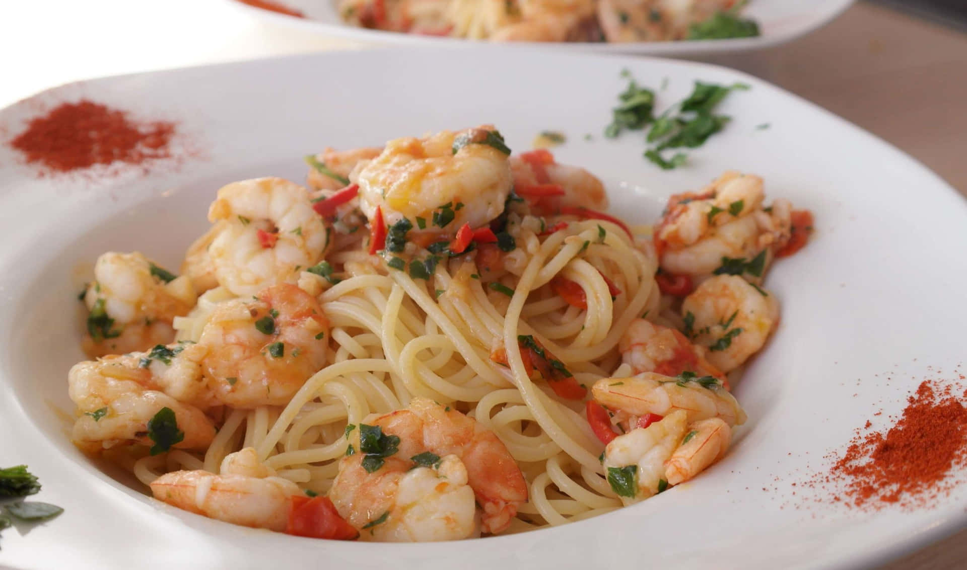 A Plate Of Pasta With Shrimp And Peppers