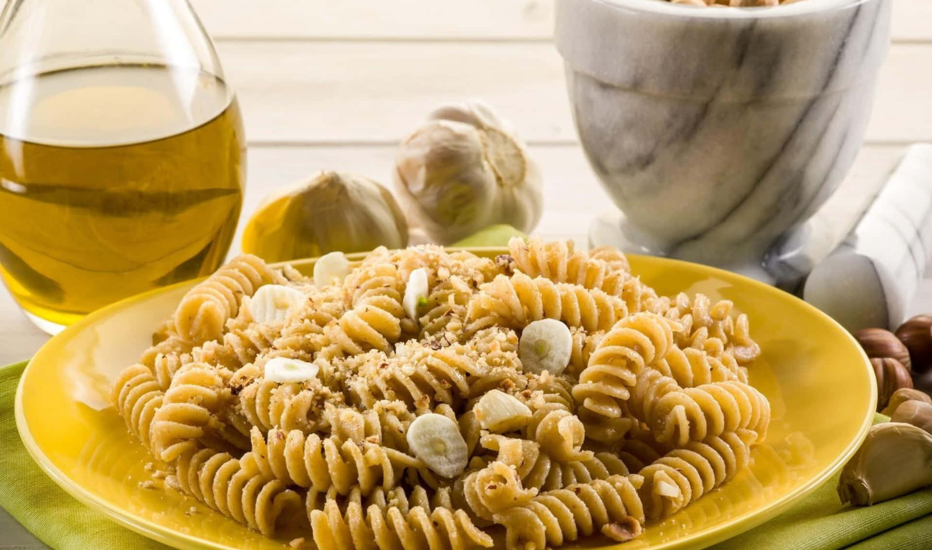A Plate Of Pasta With Garlic And Nuts