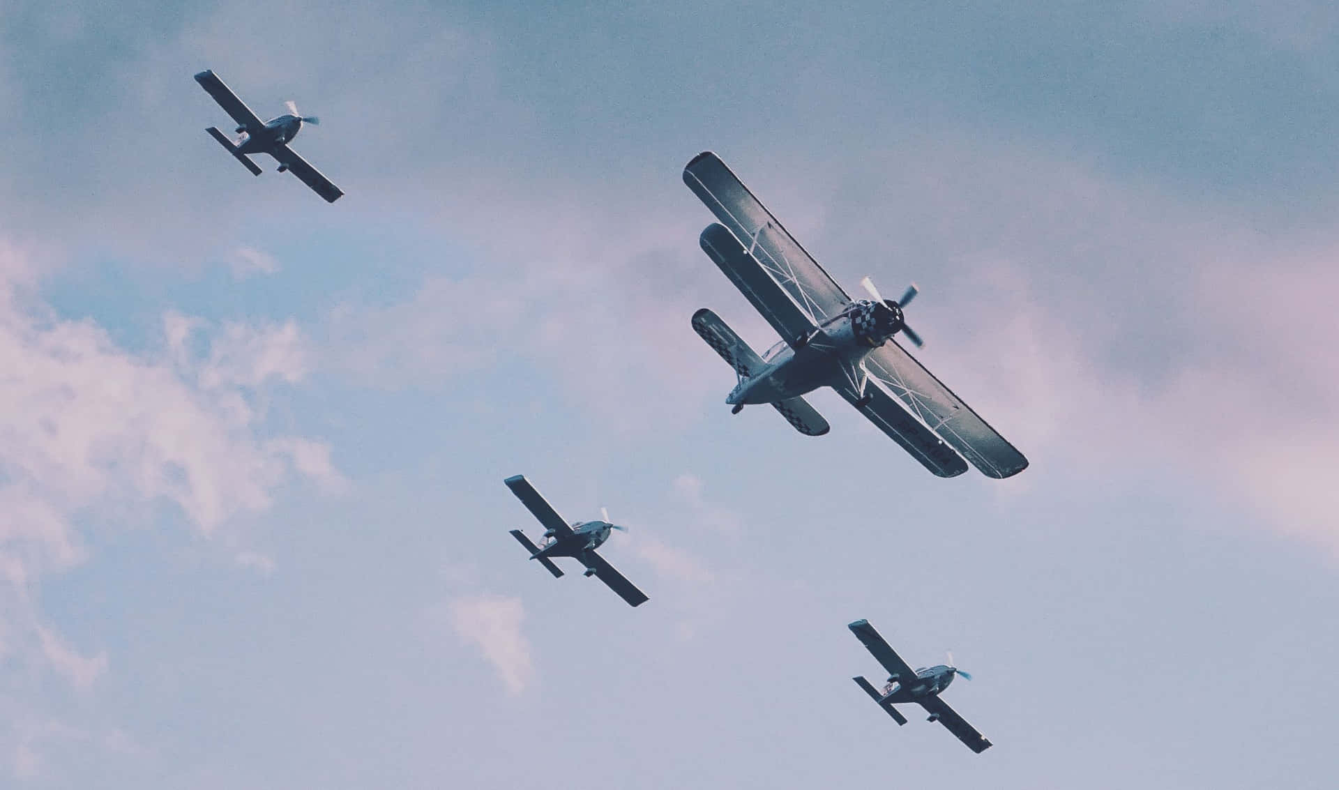 Aerial View of Small Planes Flying in Formation