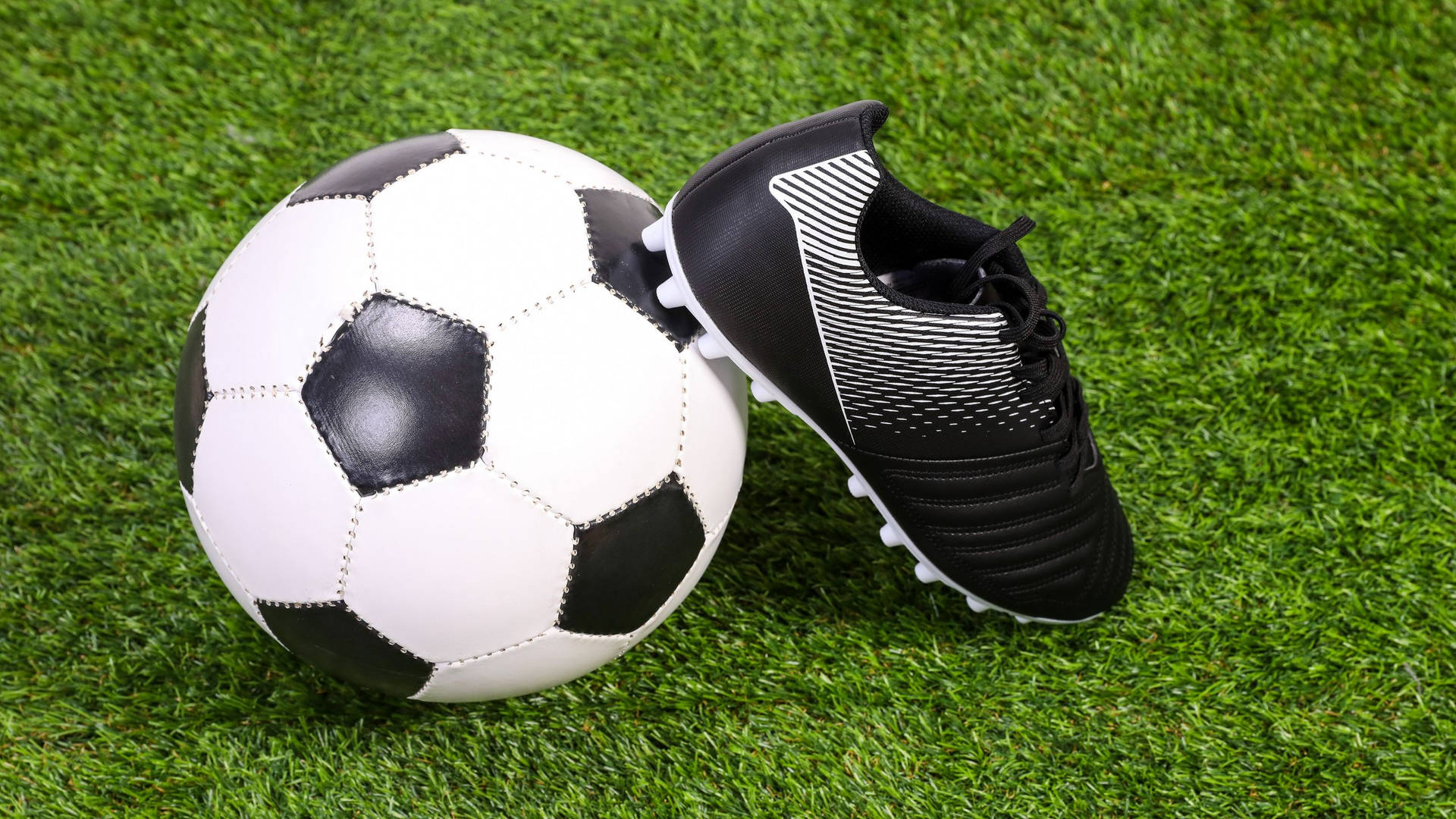 2560x1440 Soccer Ball And Shoe Wallpaper