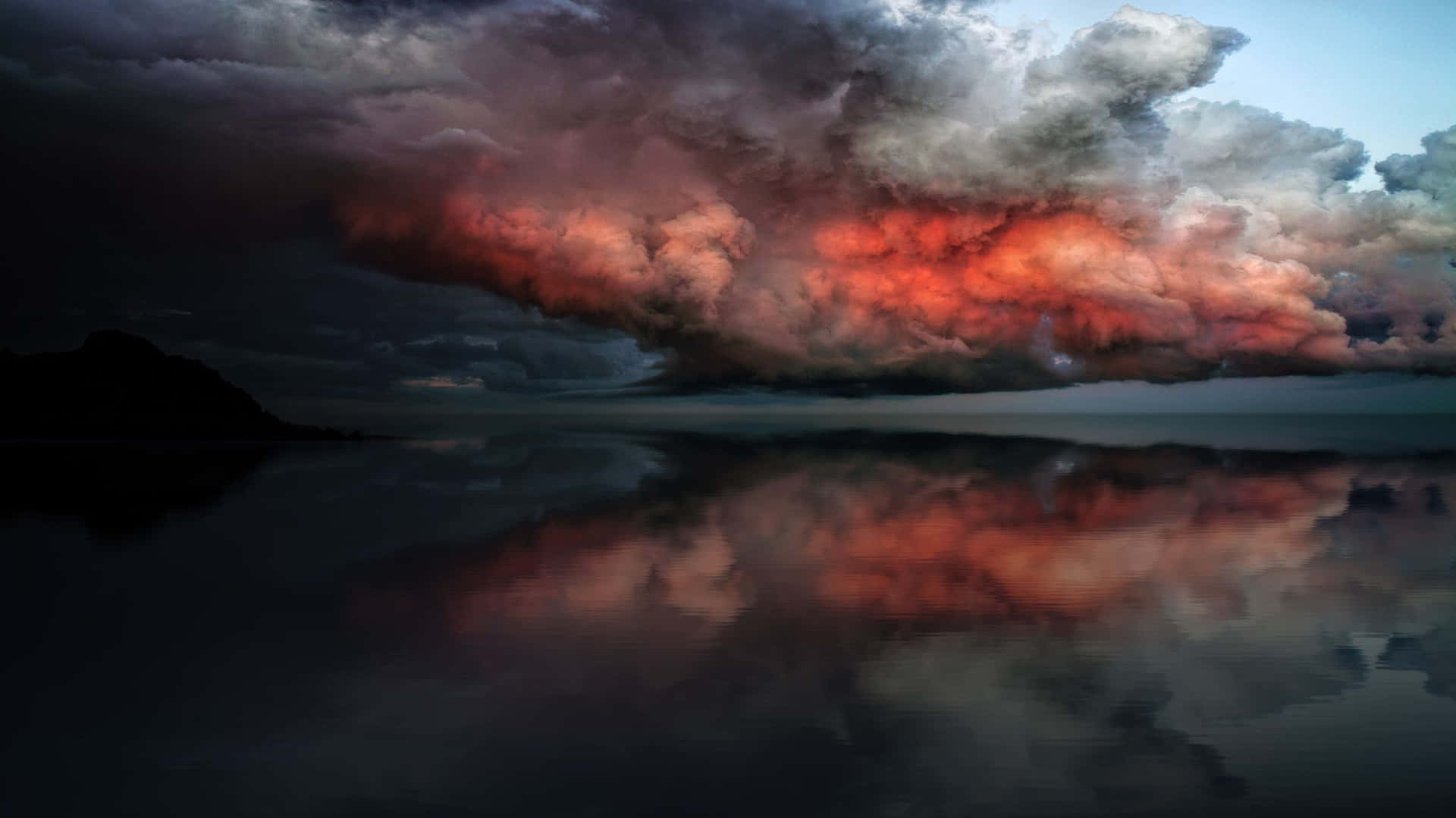 A Stormy Sky With A Red And Orange Cloud Wallpaper