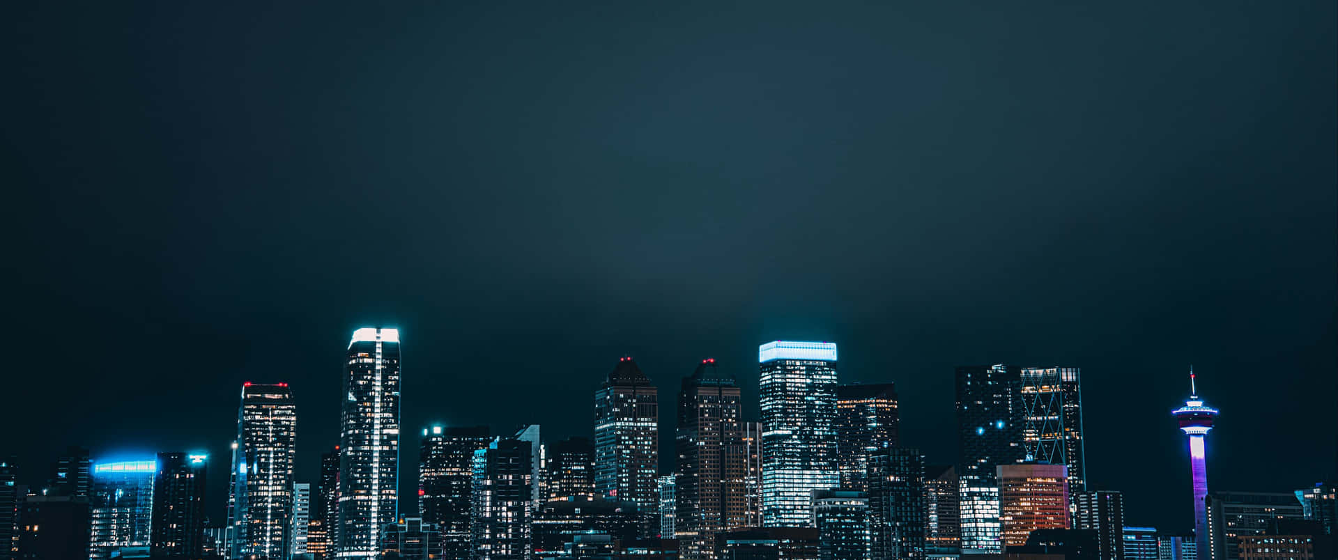 A City Skyline At Night Wallpaper