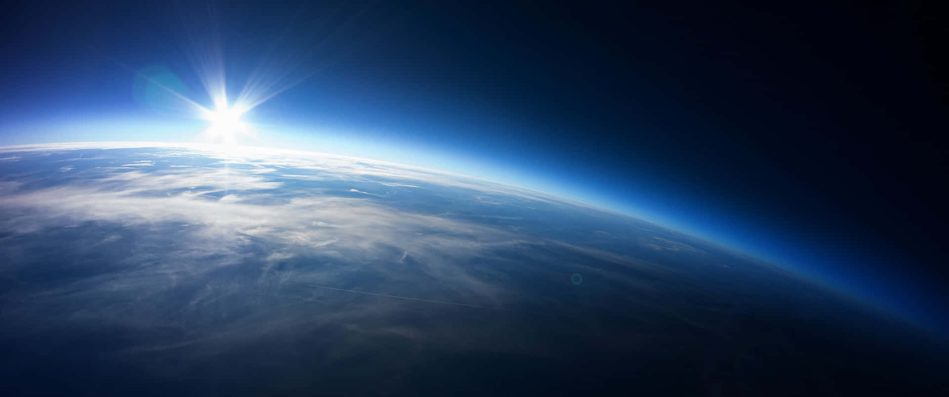 3440x1440p Sunrise From Space Background