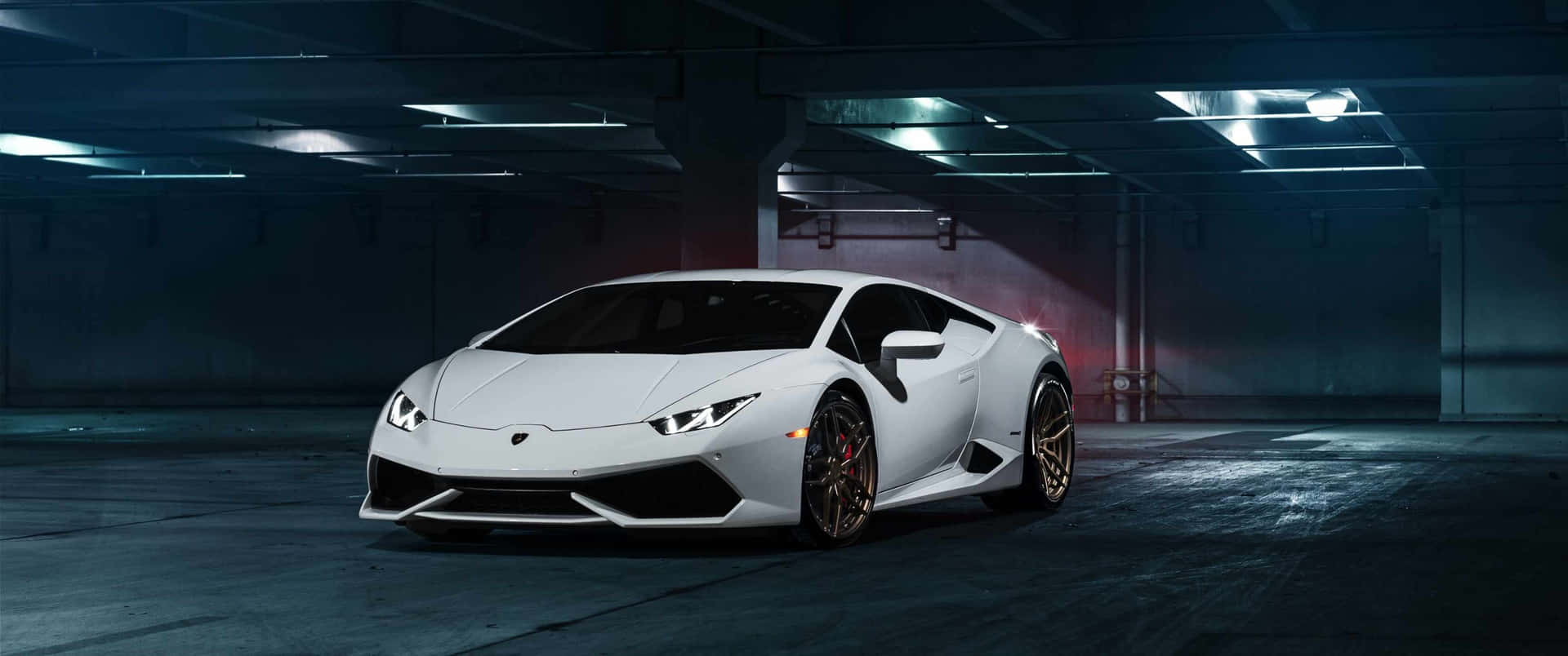 A White Sports Car Is Parked In A Dark Garage