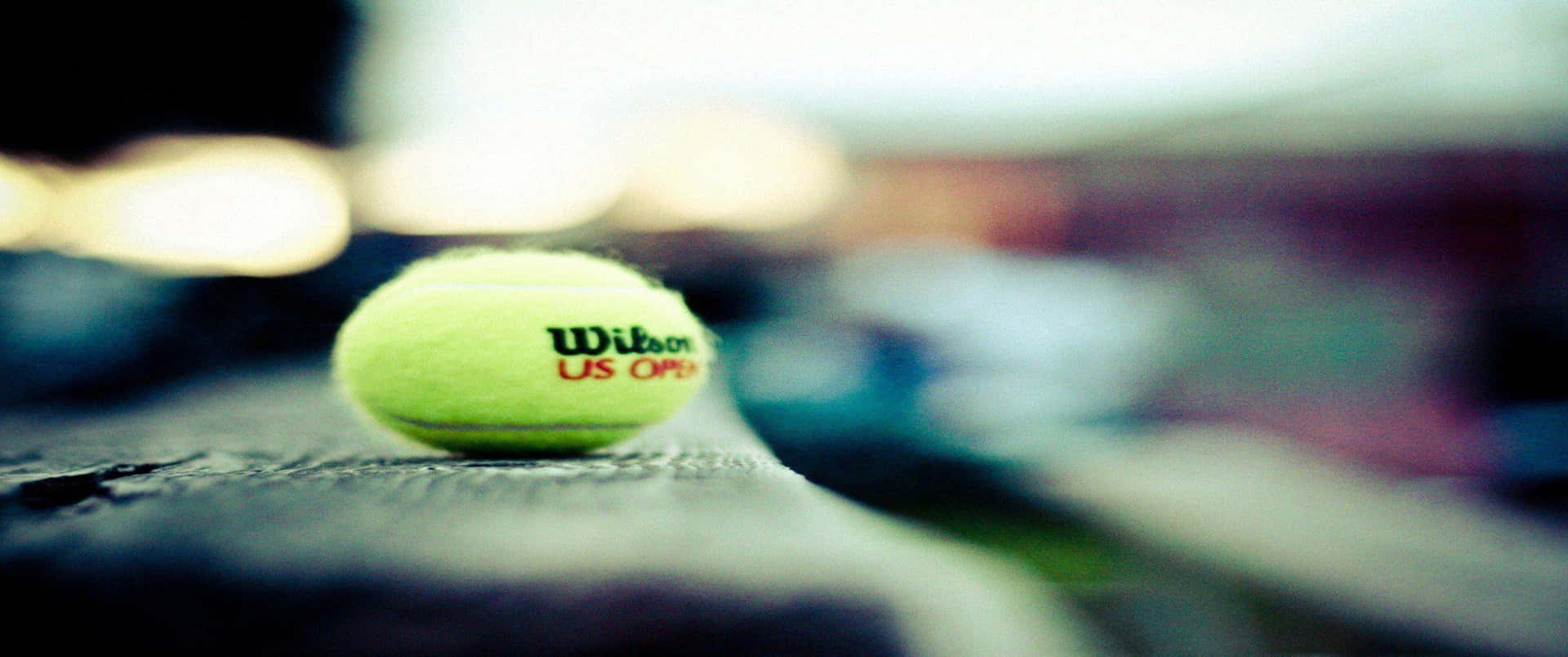 A Tennis Ball On A Wooden Bench