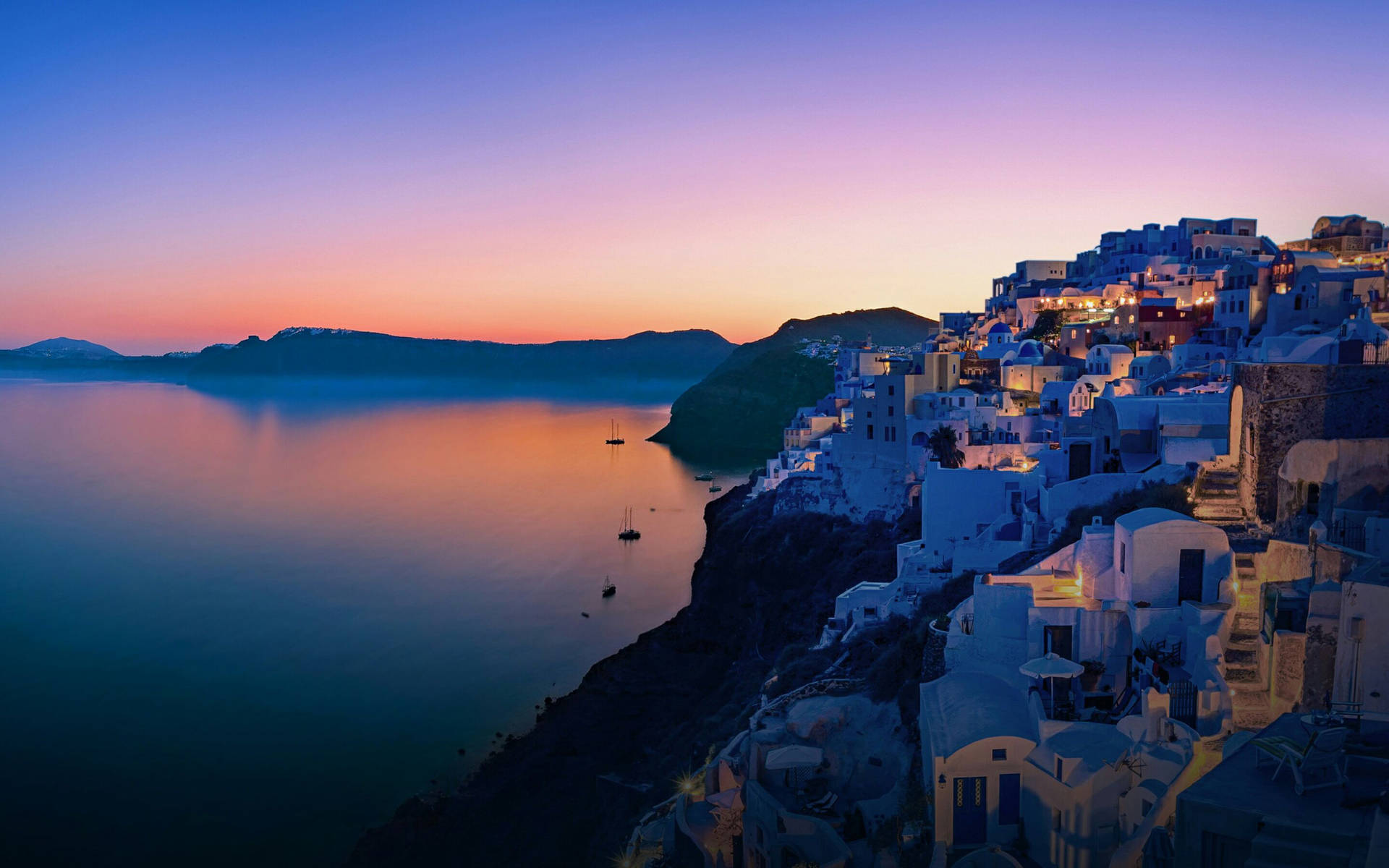 A Village At Sunset In Santorini, Greece Wallpaper