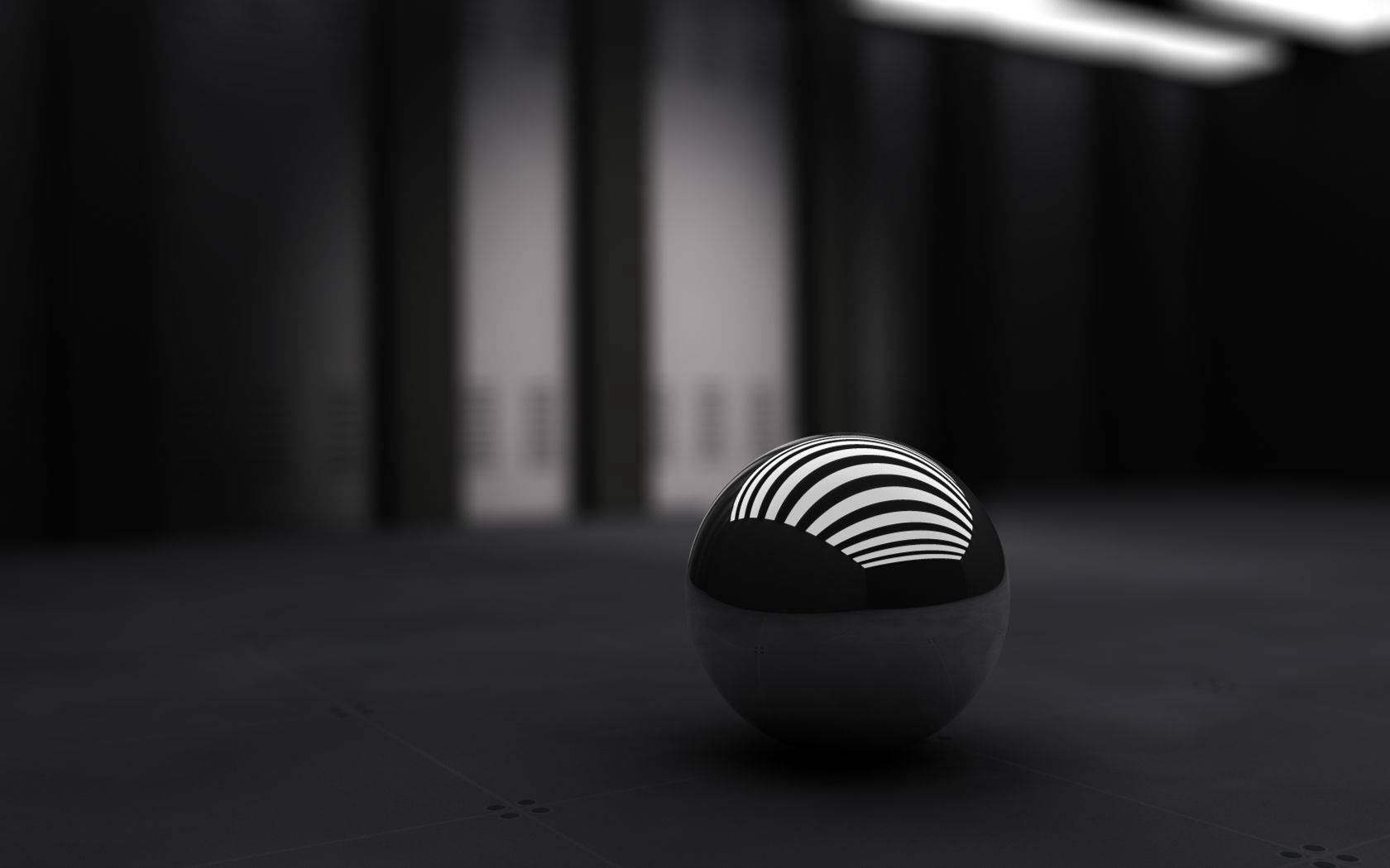 3D desktop wallpaper of small black sphere.