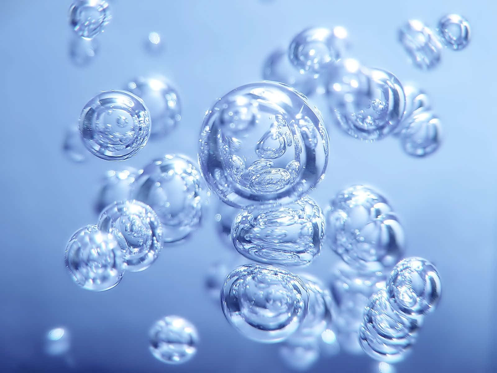 Elegant blue 3D water droplets splash on surface Wallpaper