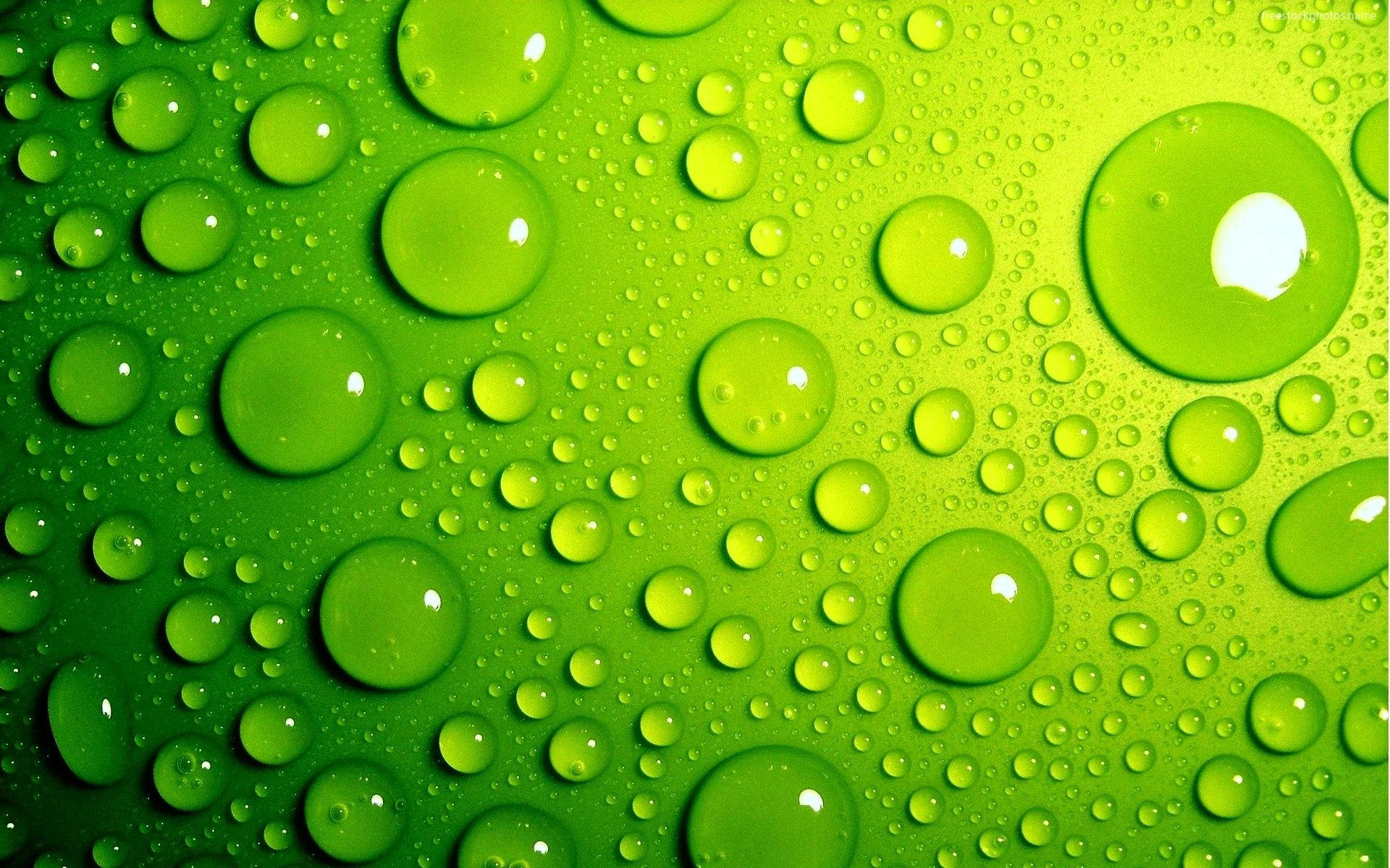 3d Water Droplets On Green Surface Wallpaper