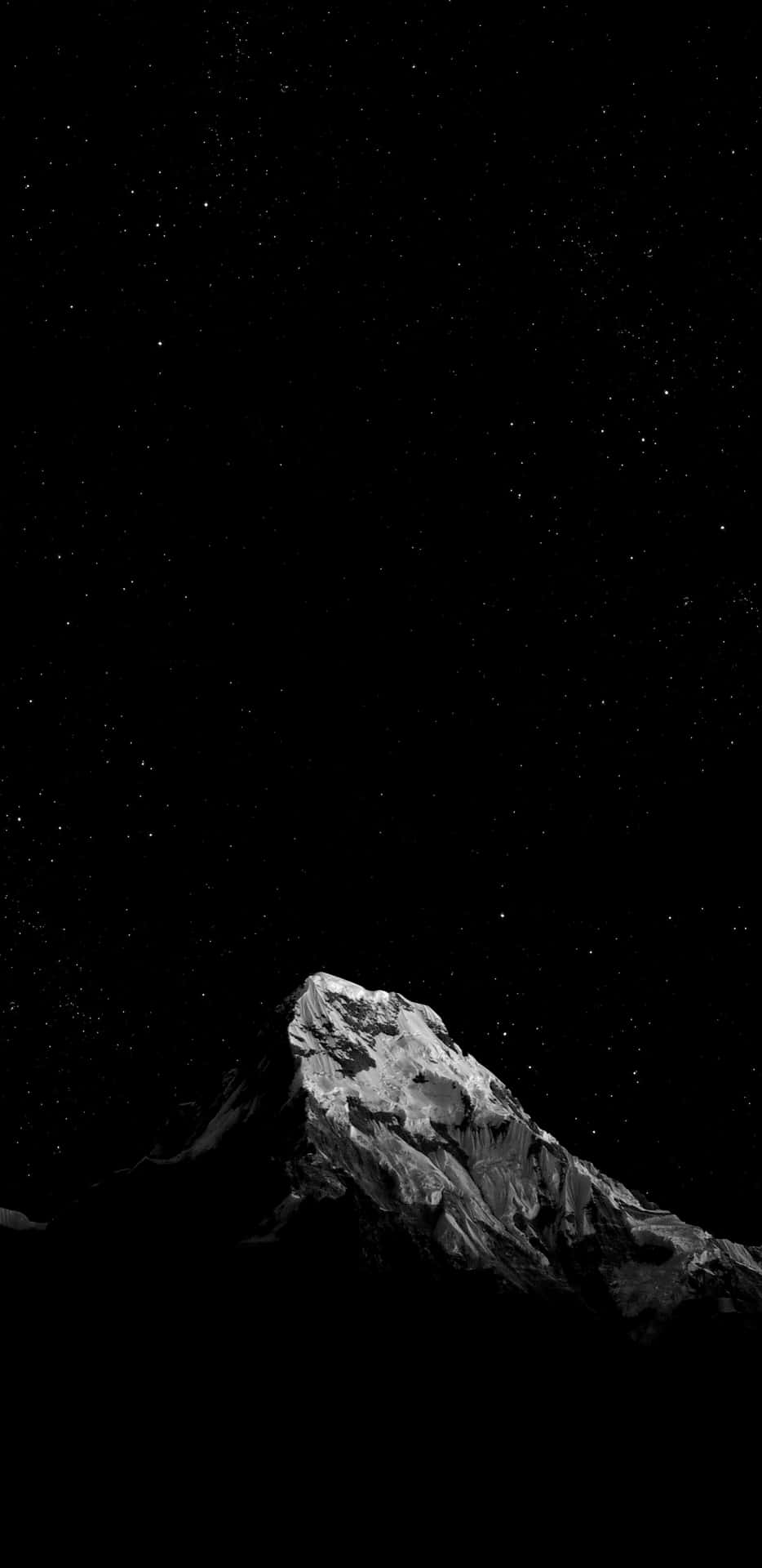 a mountain is shown in the night sky