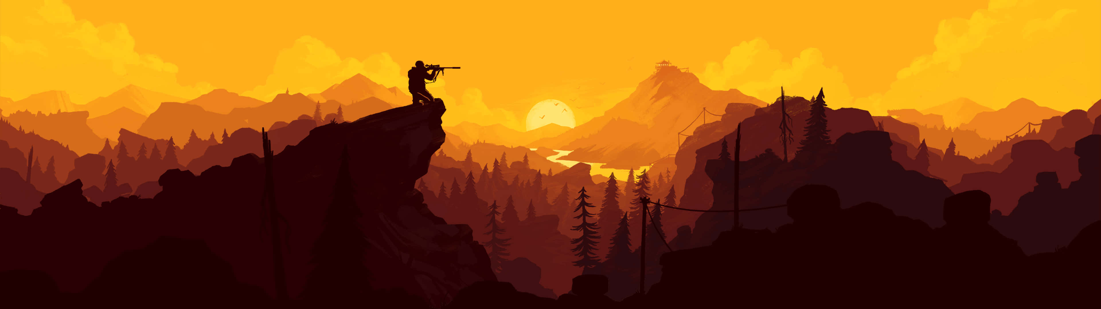 En mand står på toppen af en bjerg med et solnedgång bag ham. Wallpaper