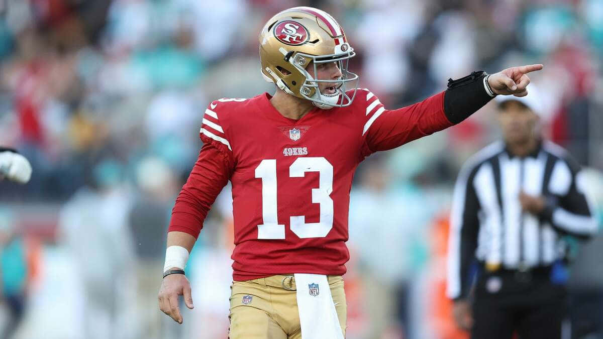 49ers Quarterback Pointing On Field Wallpaper