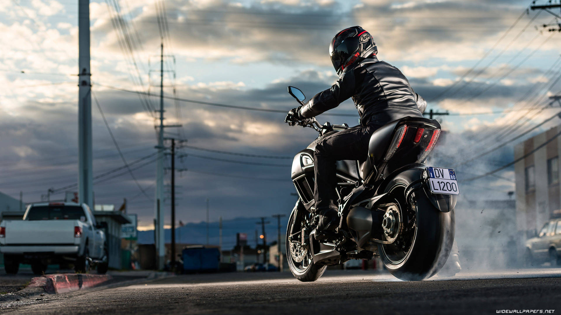 Download 4k Bike Rider On A Ducati Wallpaper 