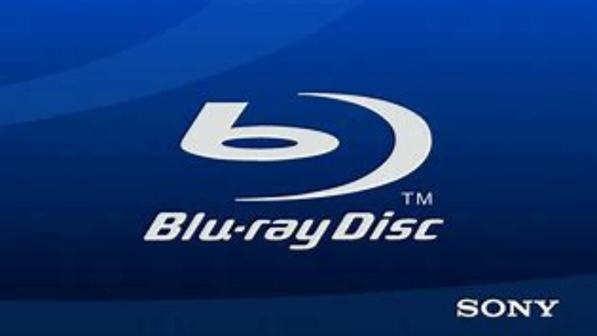 Collection of 4K Ultra HD Blu-ray discs on a shelf Wallpaper