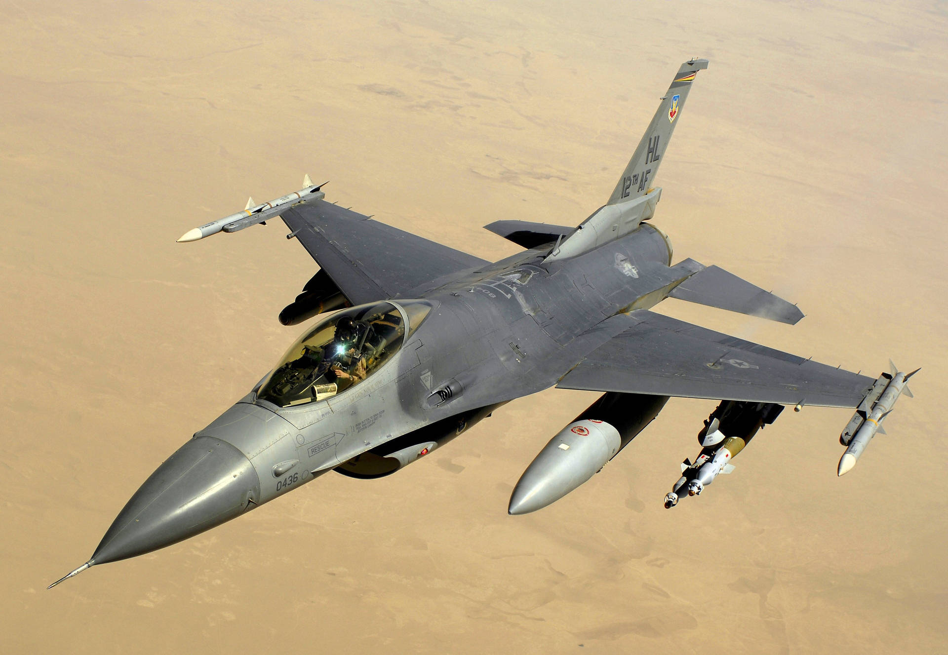 A F-16 Fighter Jet Flying In The Sky Wallpaper